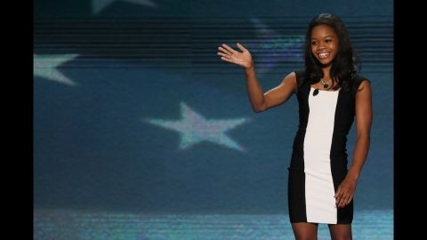 Olympic gymnast Gabby Douglas waves after leading the Pledge of Allegiance on Wednesday.
