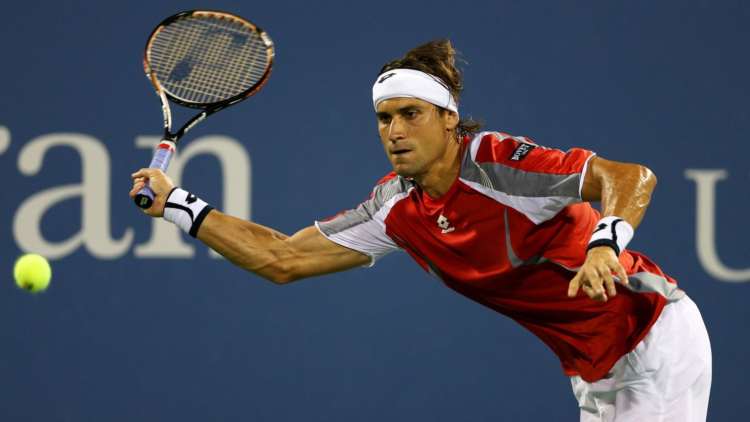 David Ferrer of Spain returns a shot against Richard Gasquet during their fourth-round match on day nine of the 2012 U.S. Open.