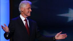 Former U.S. President Bill Clinton waves as he takes the stage
