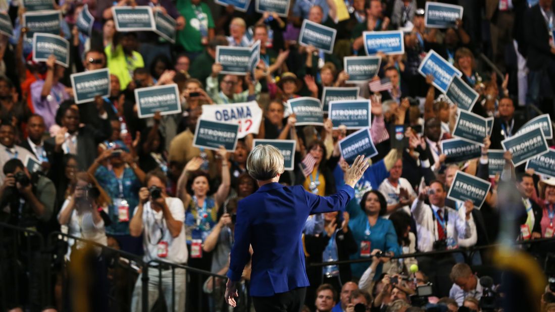 U.S. Senate candidate Elizabeth Warren of Massachusetts waves to the crowd Wednesday. A consumer advocate, she complained that people today "feel like the system is rigged against them."