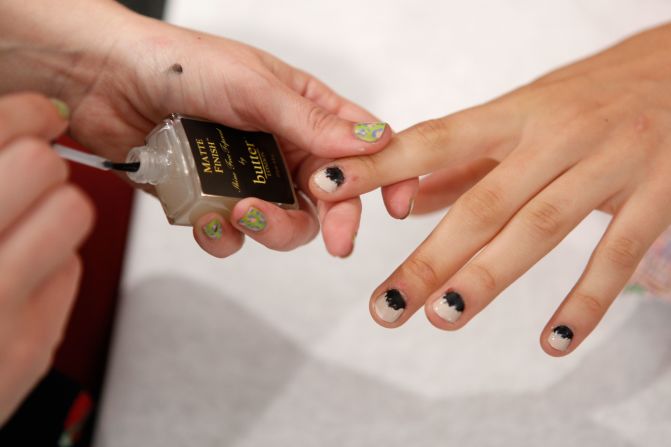A model sports a two-toned manicure by butter LONDON for the Kaeleen Spring 2013 fashion show.