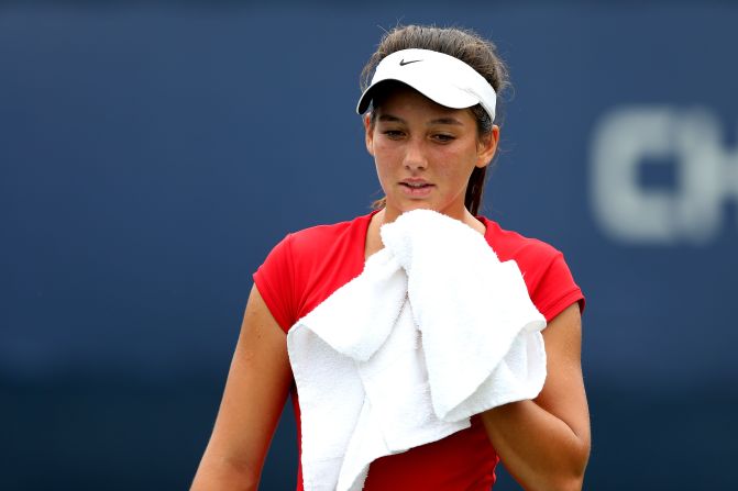 Ipek Soylu of Turkey wipes her face during a break against American Chalena Scholl during their girl's juniors singles match on Thursday. 