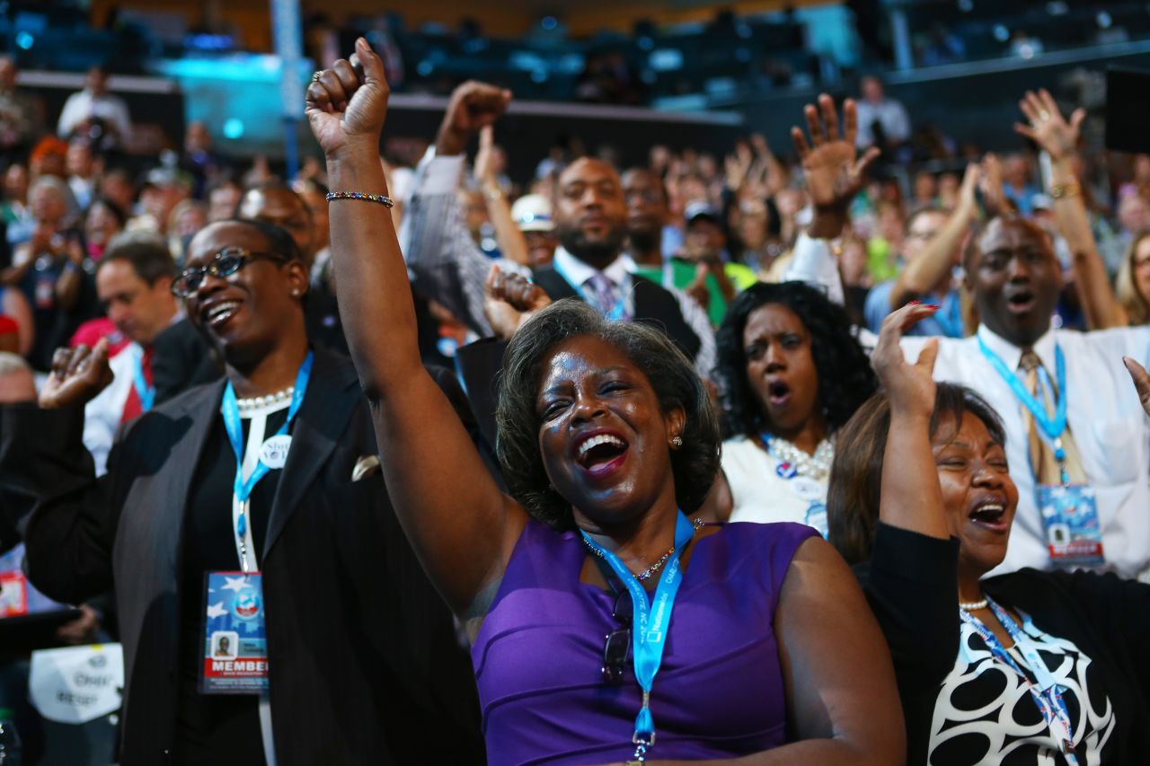 Attendees sing and dance as musician James Taylor performs on Thursday.