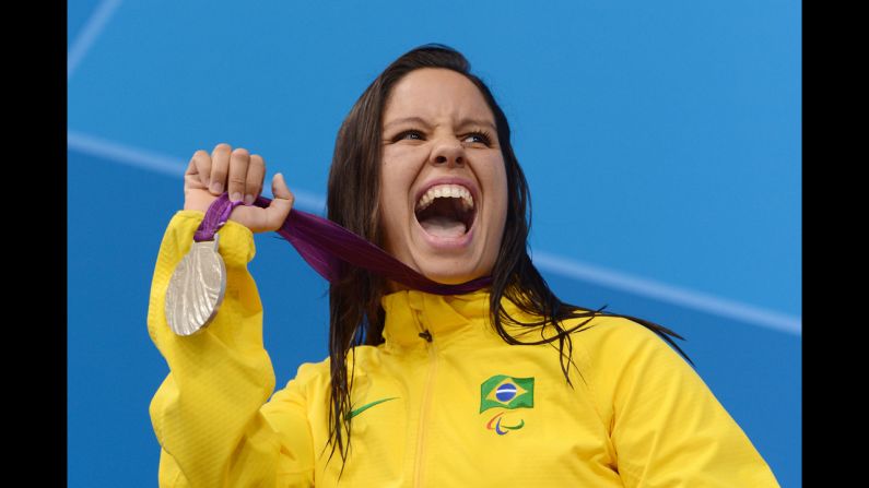 Silver medallist Edenia Garcia of Brazil poses on the podium during the medal ceremony for the women's 50m backstroke - S4 final on Thursday.