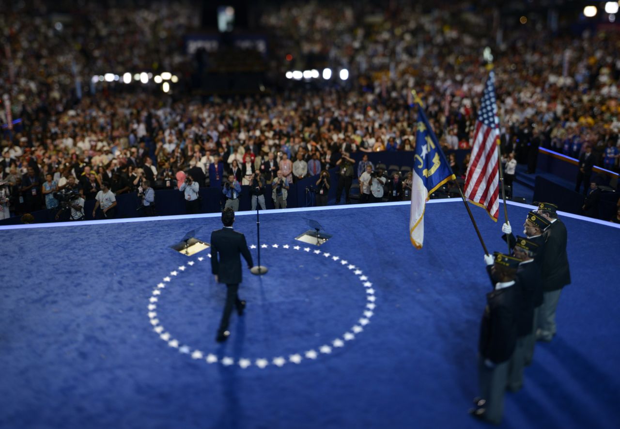 Singer Marc Anthony walks onto the stage to sing the national anthem on Thursday.