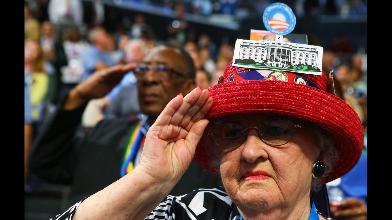 A woman salutes during the DNC on Thursday.