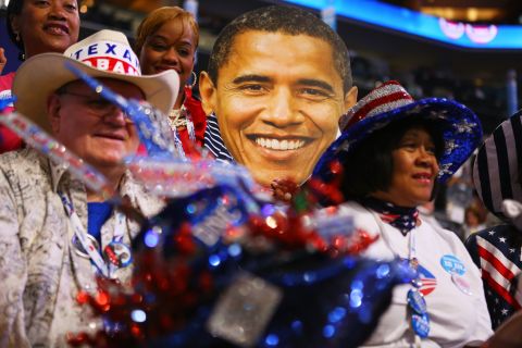 Delegates sit around a large cutout of President  Obama's head during the final day of the convention on Thursday.