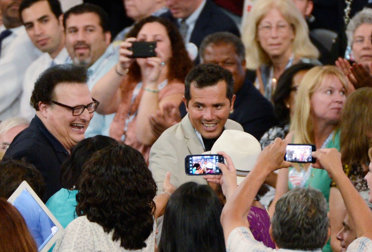 Actor John Leguizamo, center, and Wayne Knight attend the convention on Tuesday.