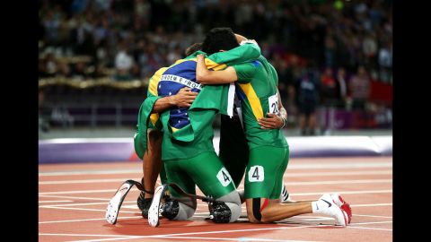 Members of the Brazilian team huddle after the men's 4x100-meter relay T42/T46 final on Thursday.