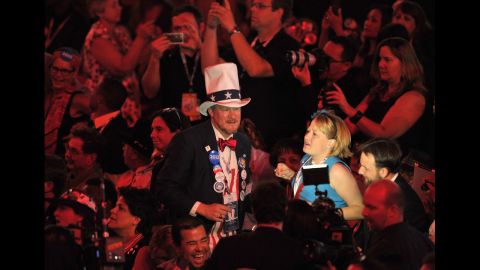 An Uncle Sam impersonator makes his way across the floor at the Time Warner Cable Arena on Thursday.
