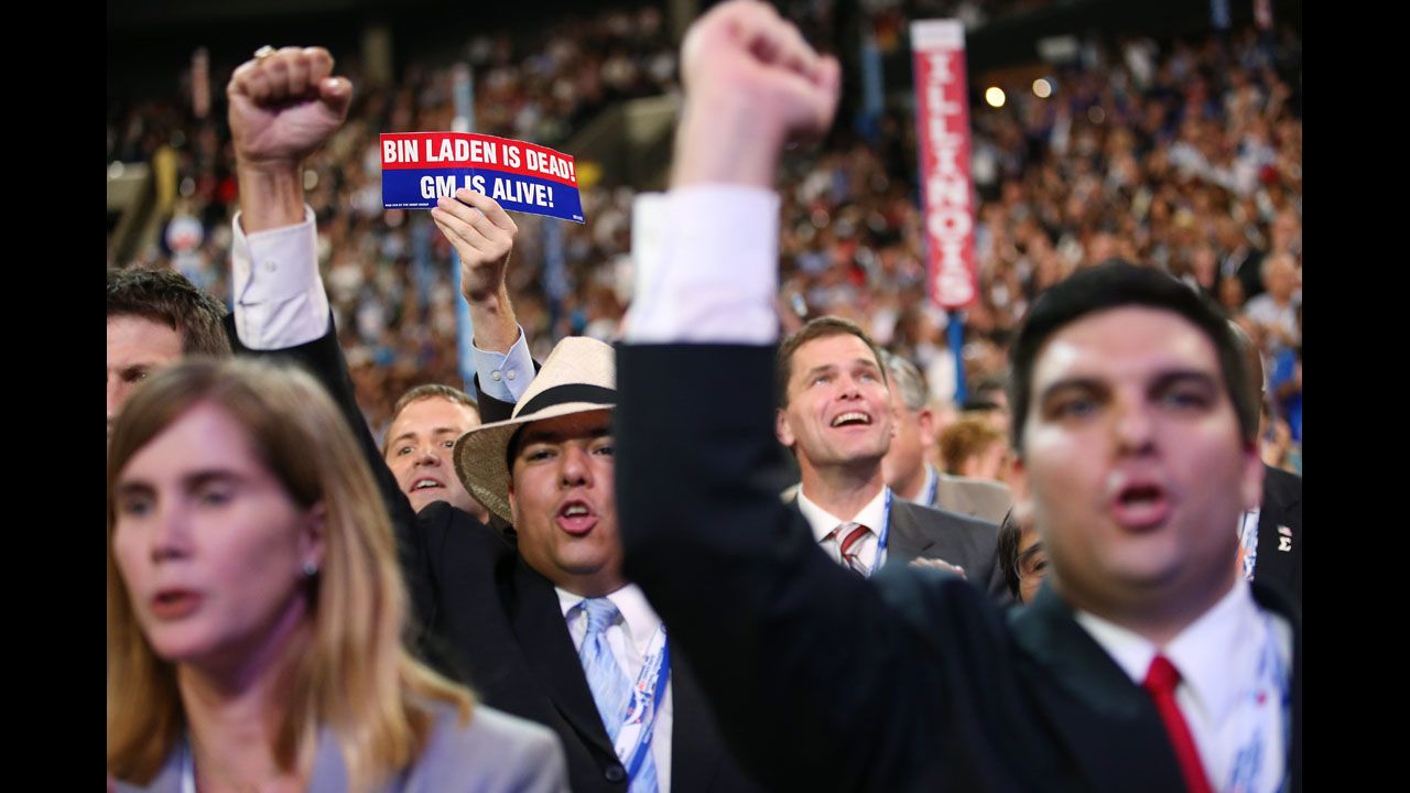A person holds a sign that says "Bin Laden Is Dead, GM Is Alive" on Thursday.