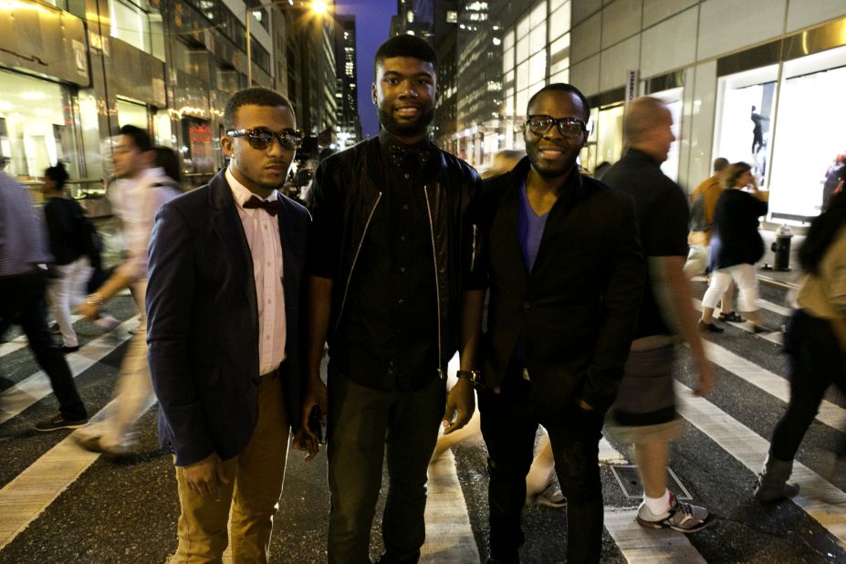 Darnell Barclift, 22, Jamel Pearson, 23, and Jason Campbell, 25, pose in front of traffic.