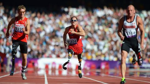 Rudy Garcia-Tolson, center, of the United States competes in the men's 100-meter T42 heats at the London 2012 Paralympic Gameson Friday.
