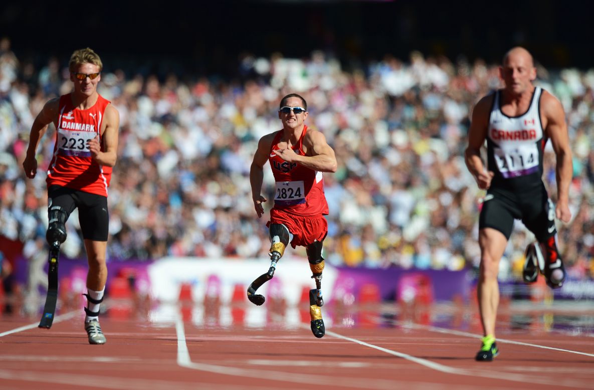 Rudy Garcia-Tolson, center, of the United States competes in the men's 100-meter T42 heats at the London 2012 Paralympic Gameson Friday.