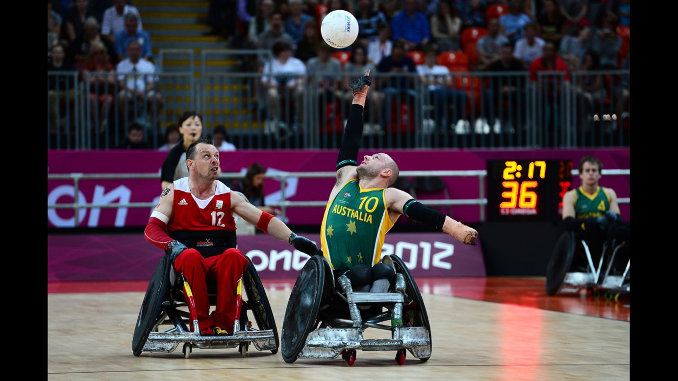 Australia's Chris Bond reaches for the ball during the mixed wheelchair rugby open match against Belgium on Friday.