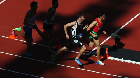 New Zealand's Tim Prendergast, No. 3, competes in the 800-meter T13 round 1 heat 1 on Friday.