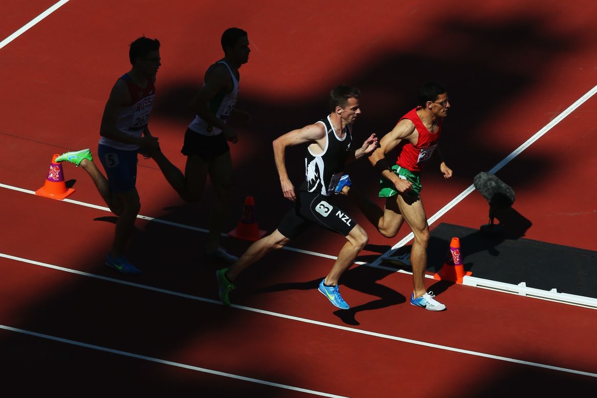 New Zealand's Tim Prendergast, No. 3, competes in the 800-meter T13 round 1 heat 1 on Friday.