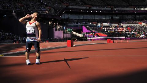 Britain's Kyron Duke asks for quiet before competing Friday in the men's javelin throw F40 final.