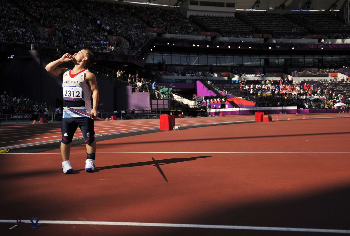 Britain's Kyron Duke asks for quiet before competing Friday in the men's javelin throw F40 final.