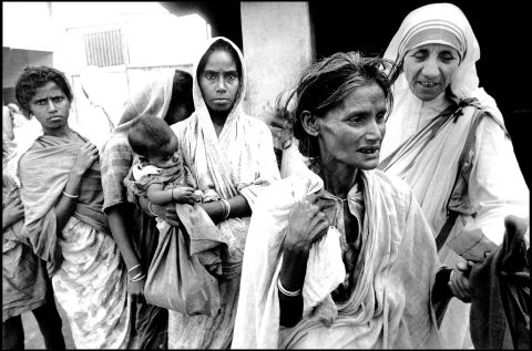 Mother Teresa, head of the Sisters of Charity, works with some of the lepers in Calcutta on December 7, 1971.