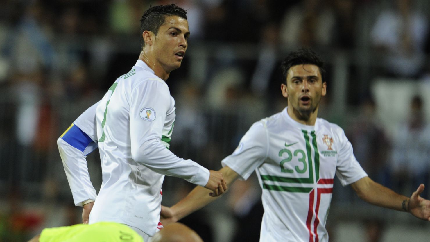 Cristiano Ronaldo scores Portugal's equalizer in Luxembourg watched by fellow striker Helder Postiga. 