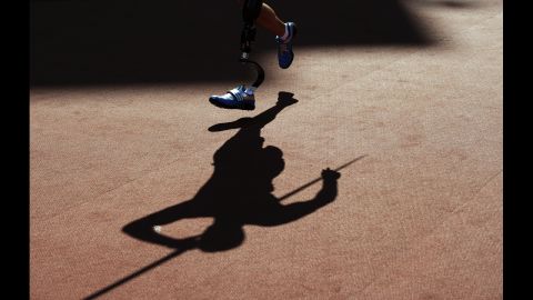 A picture shows the shadow of competitors as they compete in the men's javelin throw F42 final on Friday, September 7.