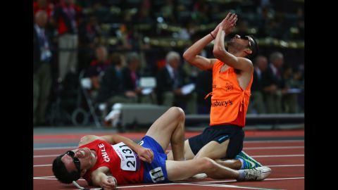 Cristian Valenzuela of Chile and guide Cristopher Guajardo react as they win gold in the men's 5000m T11 final on Friday.