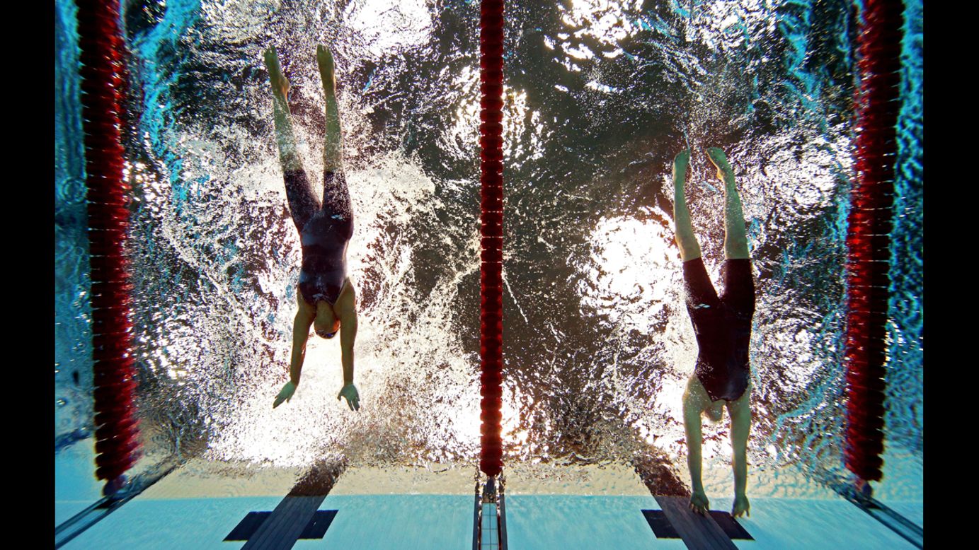 Sarah Rung, right, of Norway touches the wall ahead of Teresa Perales, left, of Spain to win gold in the women's 50m butterfly - S5 final on Friday.