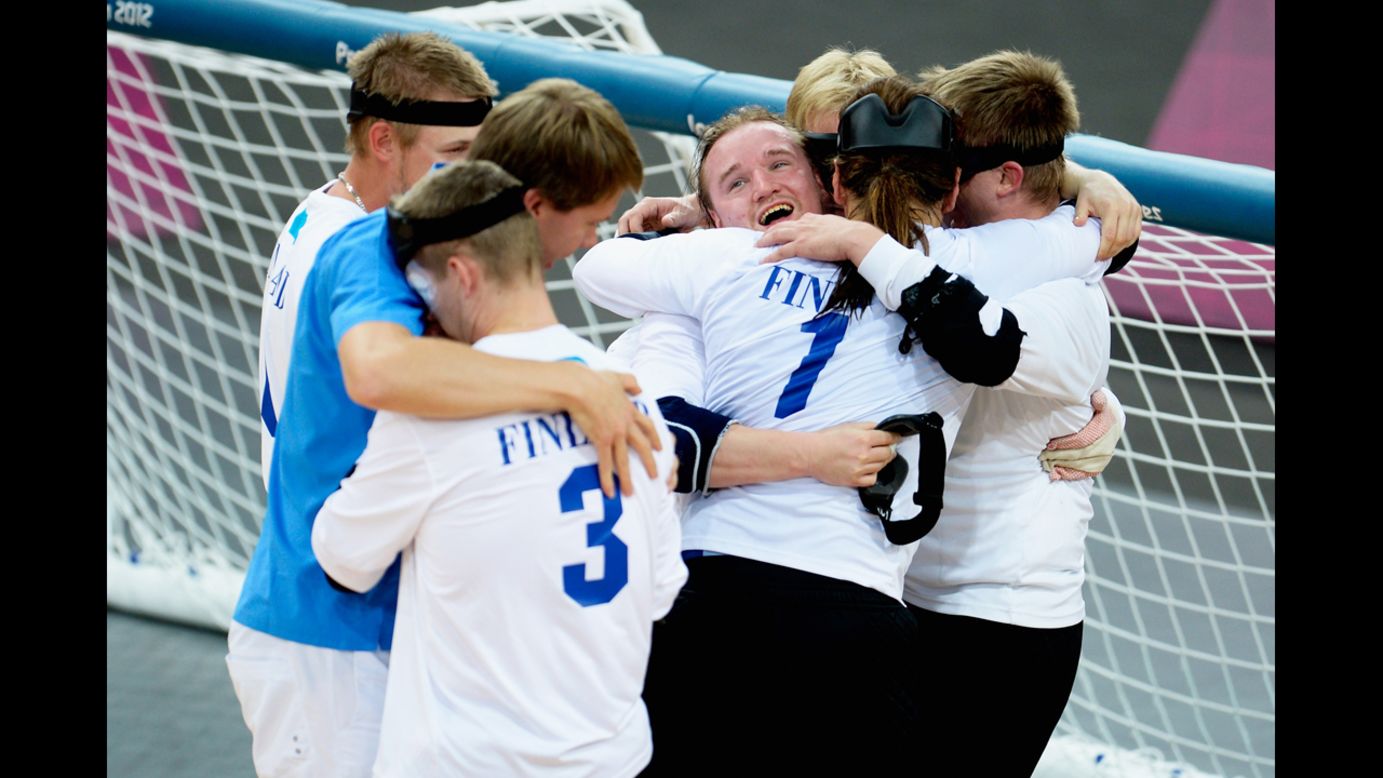 The team of Finland celebrates after winning their men's team goalball gold medal match against Brazil on Friday.