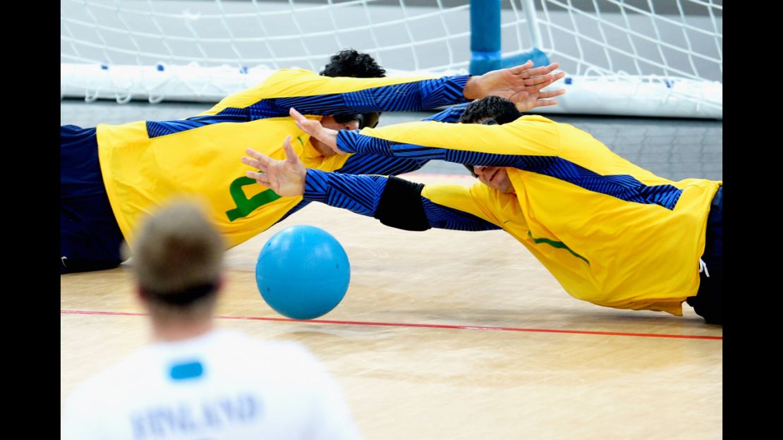 Leomon Moreno Da Silva of Brazil and teammate Jose Roberto Ferreira De Oliveira block the ball during the 2012 Paralympics.