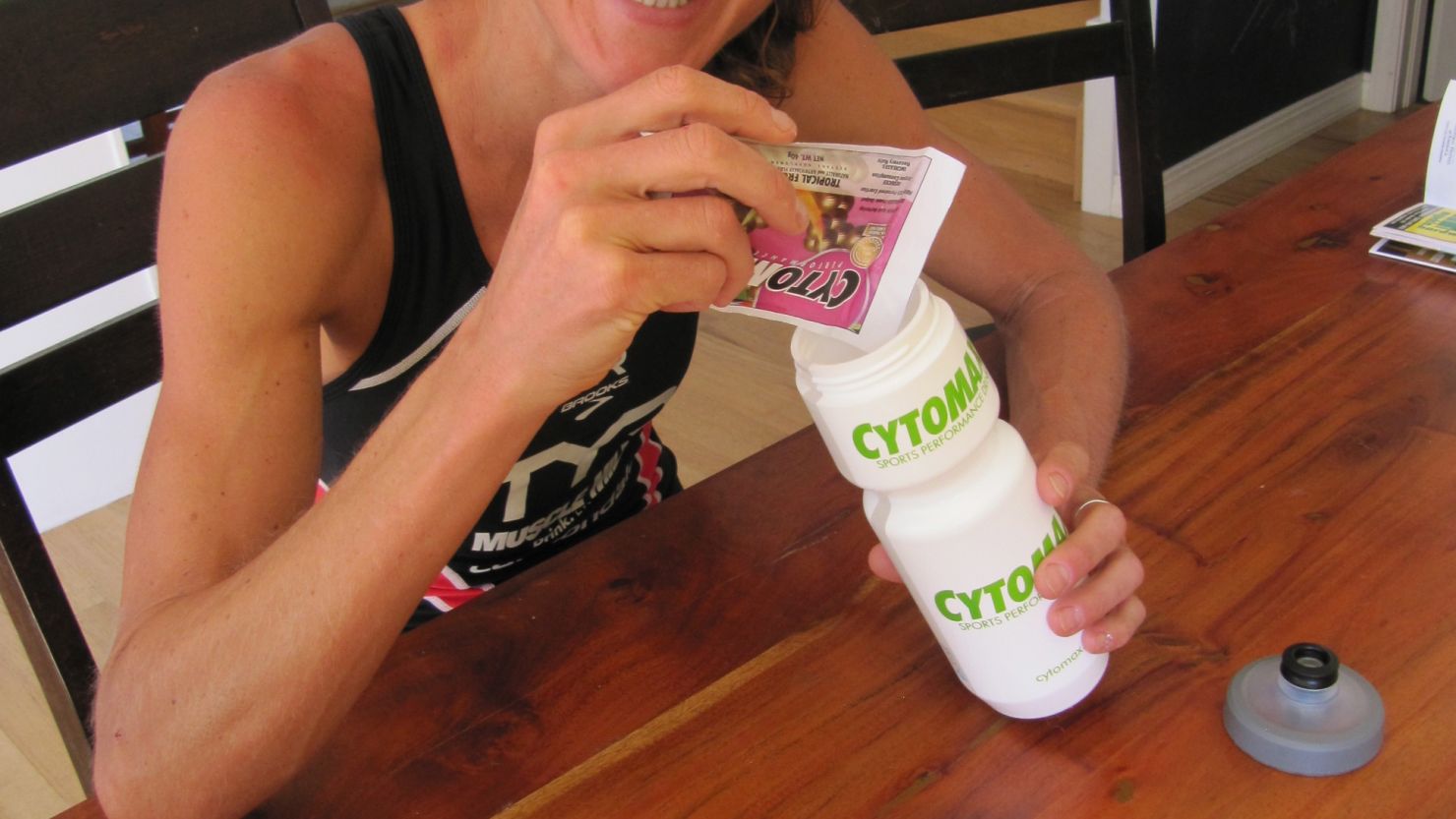 Chrisse Wellington makes herself an energy drink after a training session. 
