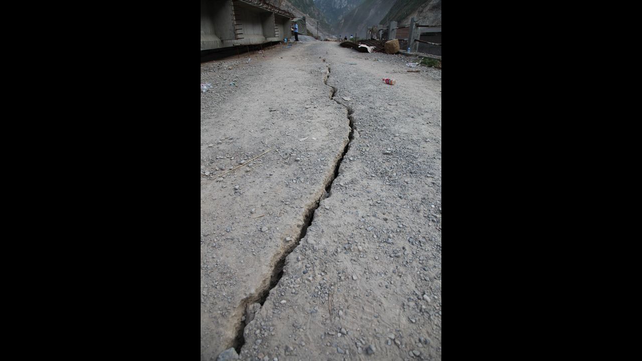 A crack from an earthquake winds through the ground in Luozehe Town in Yunnan province. 