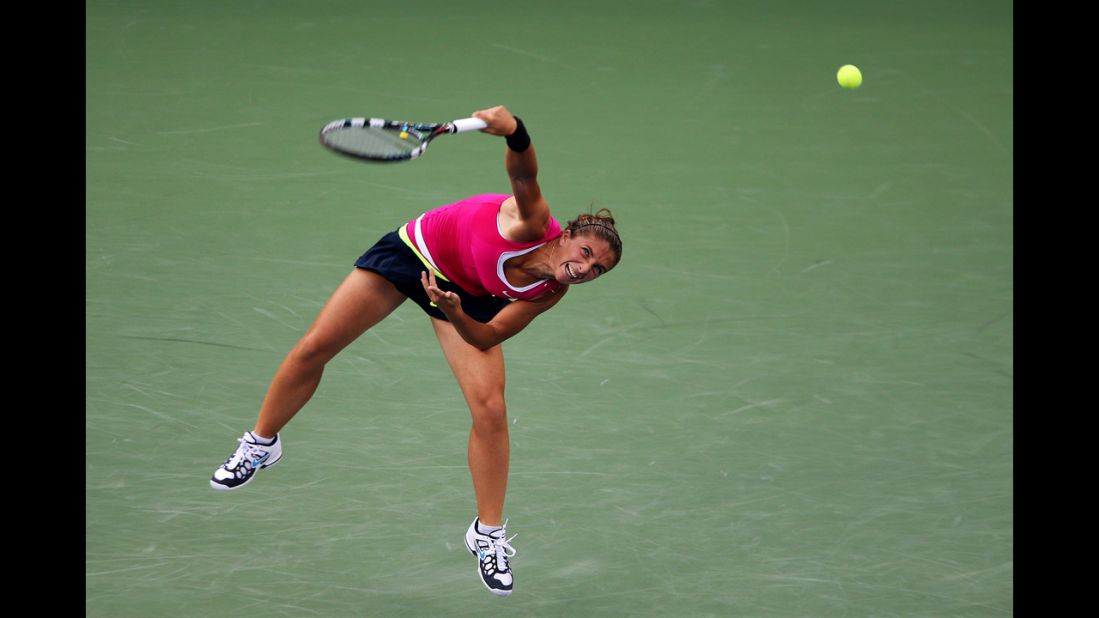 Sarah Errani of Italy serves in her match against Serena Williams of the United States during a women's singles semifinal match Friday.