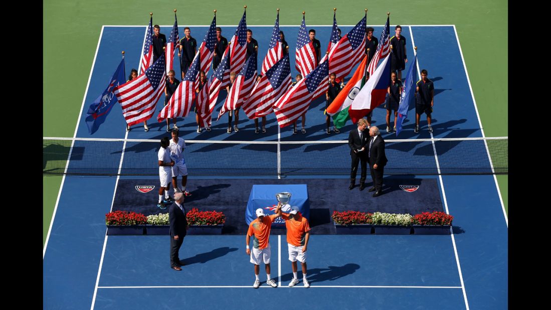 Bob Bryan and Mike Bryan of the United States pose with their trophy after their men's doubles final match against Leander Paes of India and Radek Stepanek of the Czech Republic on Friday.