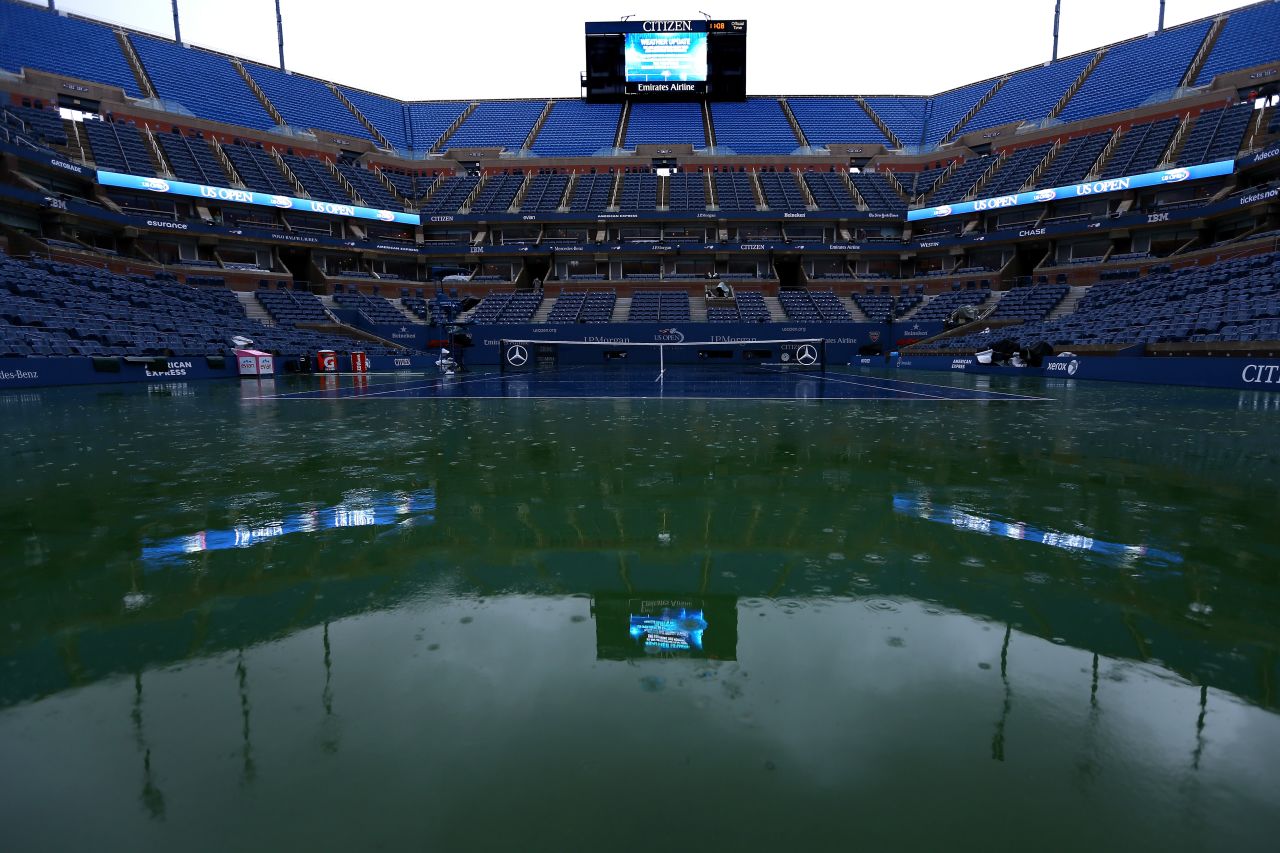 Rain falls on center court in Arthur Ashe stadium, causing officials to suspend play on day 13 of the 2012 U.S. Open on Saturday, September 8.