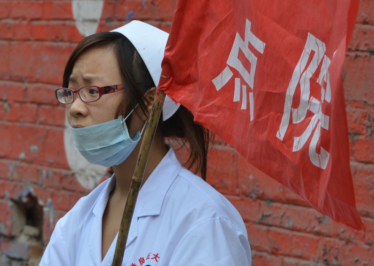A nurse waits outside a first aid center on Saturday. 