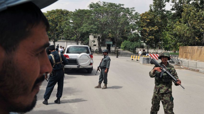Afghan security forces stand guard at the site of a suicide attack in the city's diplomatic quarters on September 8.
