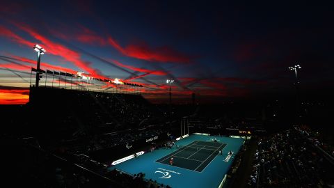The sun sets as Shingo Kunieda of Japan, front left, plays against Stephane Houdet of France in the men's wheelchair tennis gold medal match on Saturday.