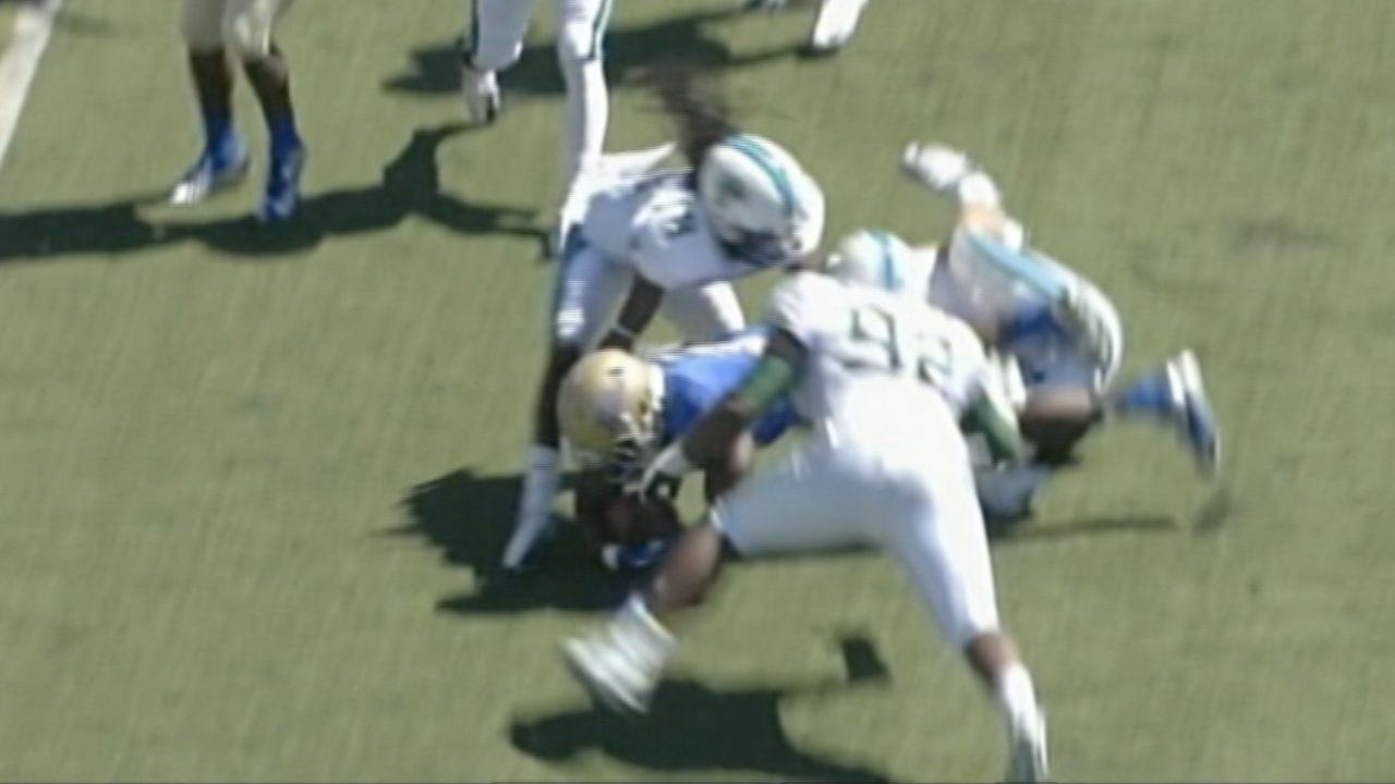 Devon Walker of Tulane (facing the camera) is shown in the instant before he collided with a teammate. 