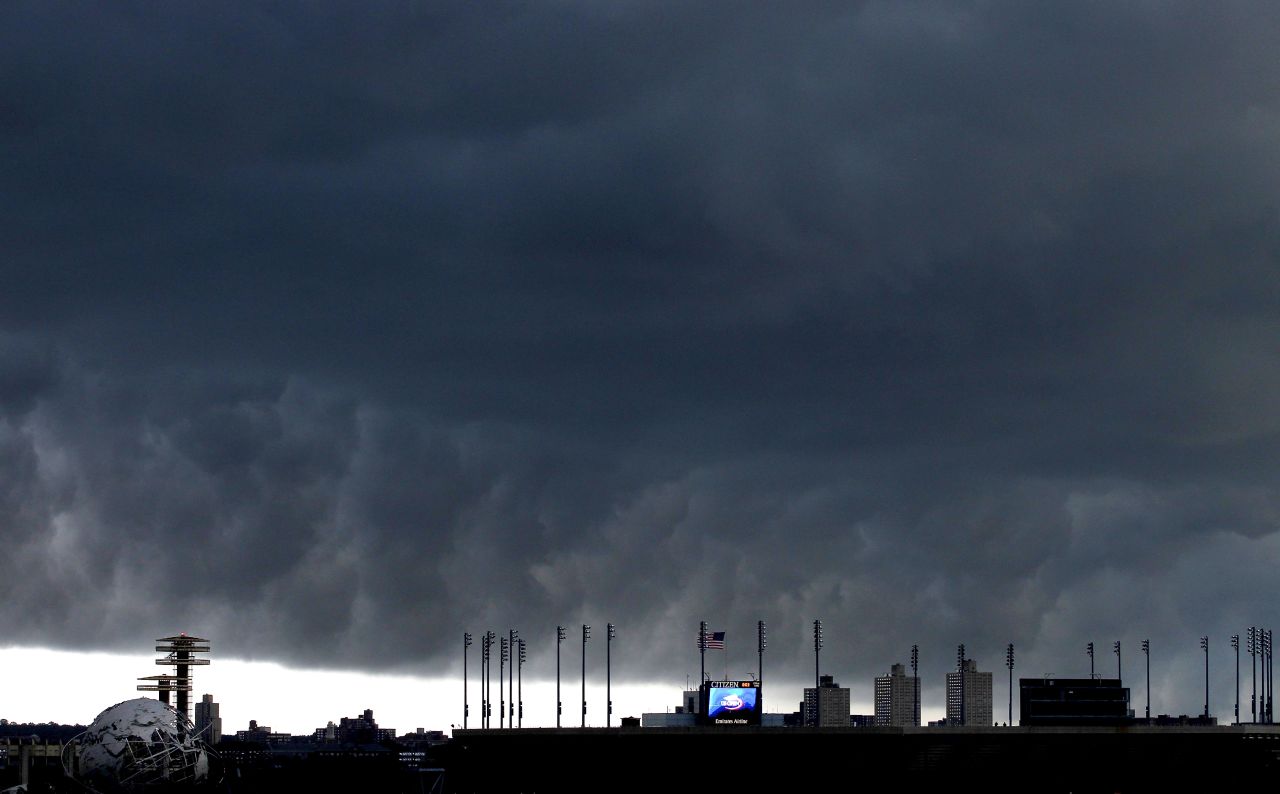 A storm front passes behind the USTA Billie Jean King National Tennis Center. Scheduled matches were suspended at the U.S. Open tennis tournament in Queens after two tornadoes touched down nearby.