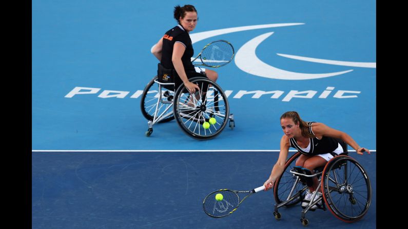 Aniek Van Koot, left, and Jiske Griffioen of the Netherlands in action against Marjolein Buis and Esther Vergeer, also of the of Netherlands, in the women's doubles gold medal match.