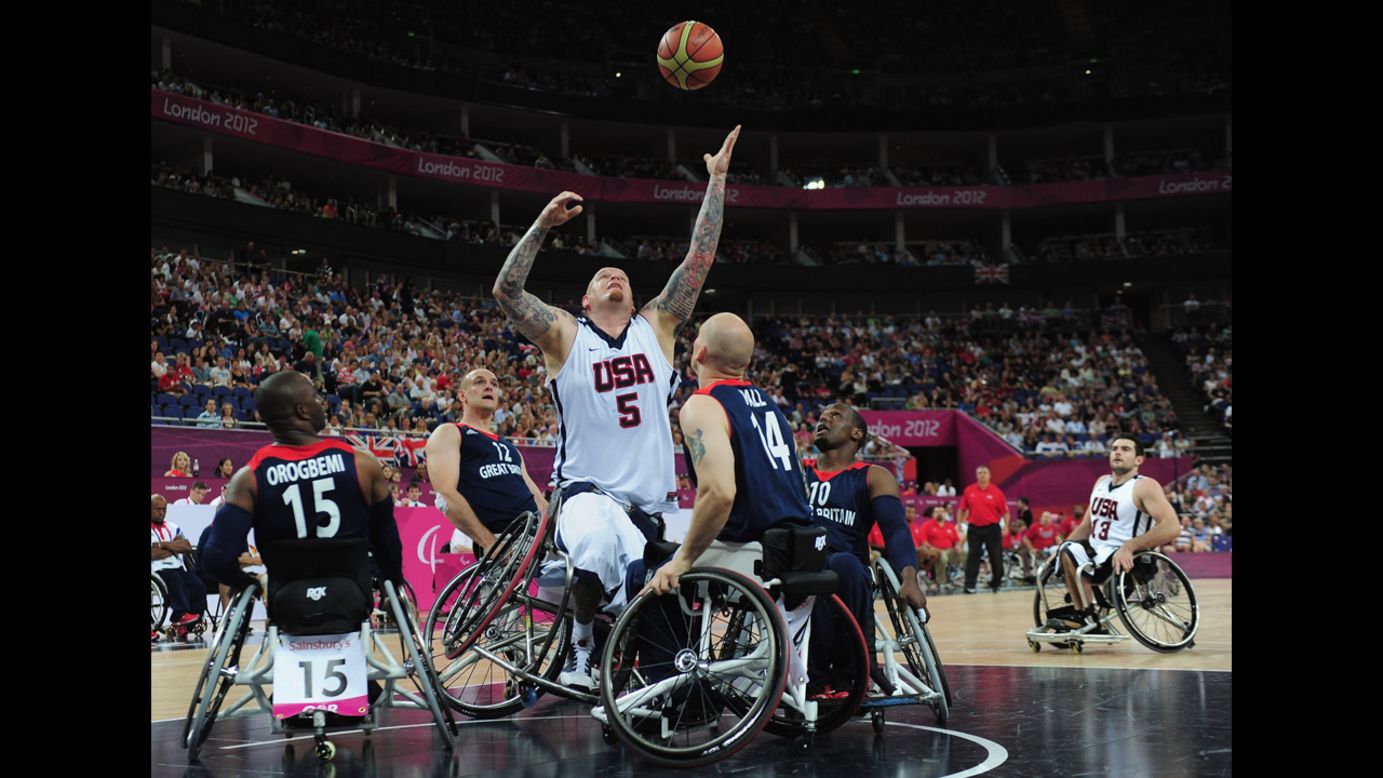 The United States' Joseph Chambers reaches for the ball during Saturday's bronze medal wheelchair basketball game between United States and Great Britain.