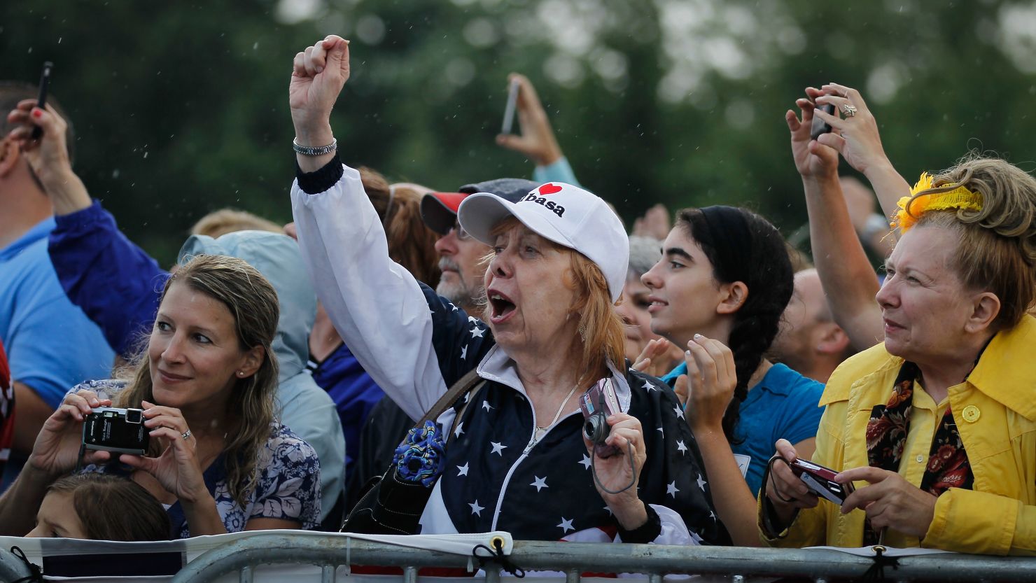People cheer as Mitt Romney arrives for a campaign stop at Mapleside Farms on June 17, 2012 in Brunswick, Ohio. 