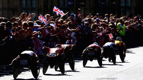 Athletes compete in the men's T54 marathon near Westminster and the Houses of Parliament on Sunday.