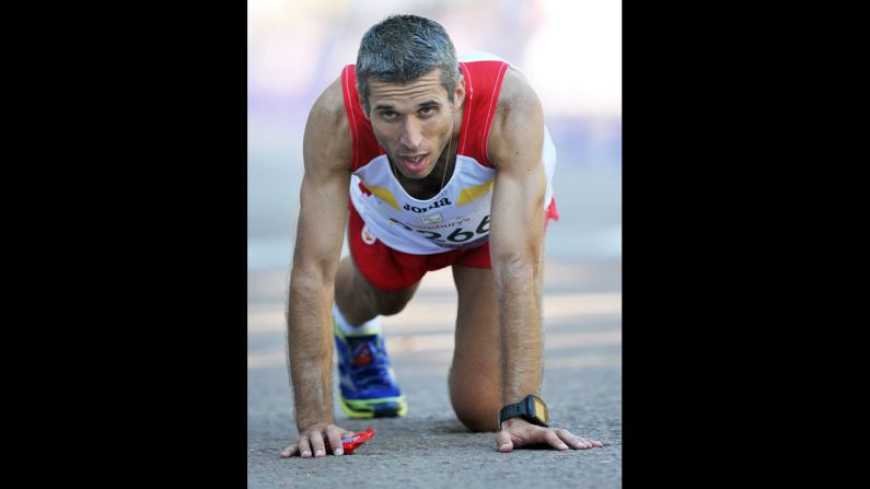 Spain's Alberto Suarez Laso reacts after finishing in first place in the men's marathon T12 in central London on Sunday.