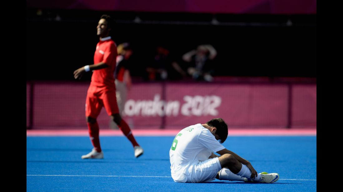 Mateus Francisco Tostes Calvo of Brazil, in white, sits on the field after losing to Iran 5-0 in the men's team football 7-a-side bronze medal match Sunday.
