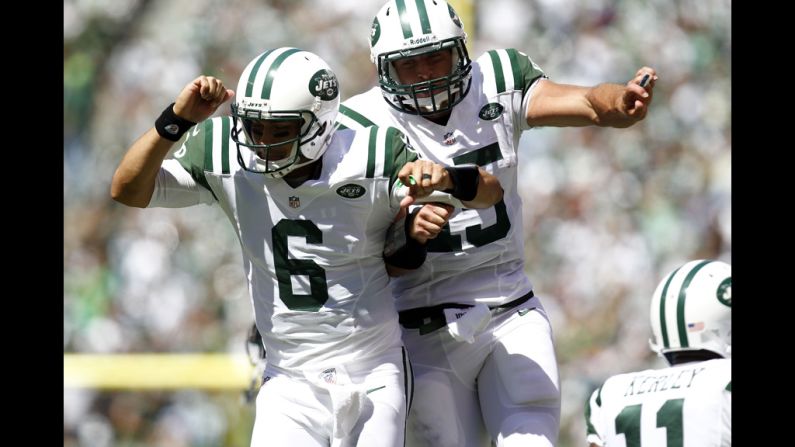 No. 6 Mark Sanchez and No. 15 Tim Tebow of the Jets celebrate a touchdown against the Bills during their season opener at MetLife Stadium in Rutherford, New Jersey, on Sunday.