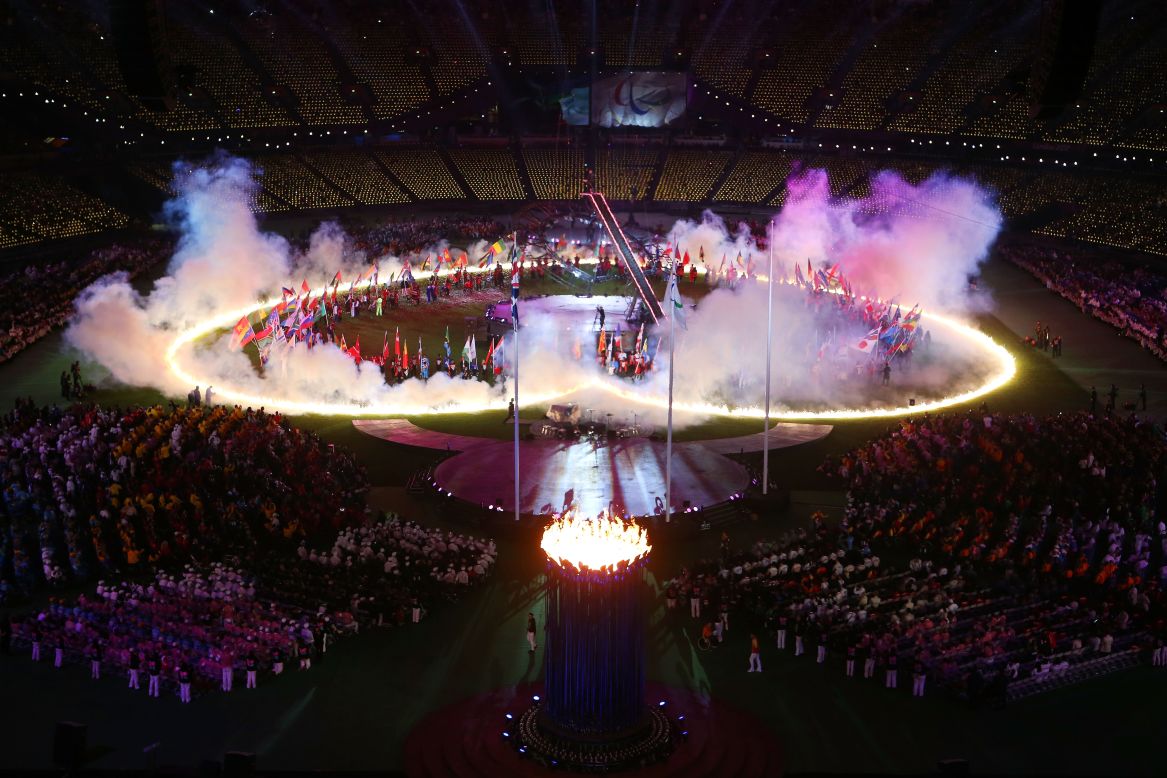 A heart of flames is displayed on the arena floor.