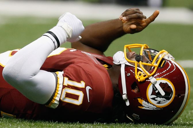 No. 10 Robert Griffin of the Redskins celebrates after throwing a touchdown pass against the Saints on Sunday.