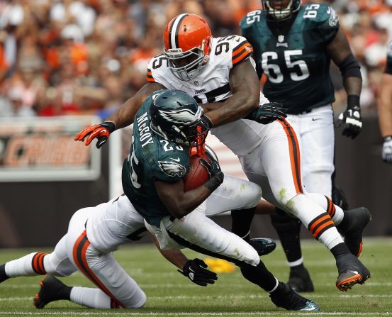 No.25 running back LeSean McCoy of the Philadelphia Eagles is hit by No. 95 defensive lineman Juqua Parker of the Cleveland Browns on Sunday.